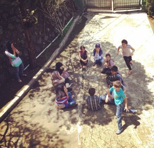 Tahira's children playing happily together outside - not an iPad or screen in sight
