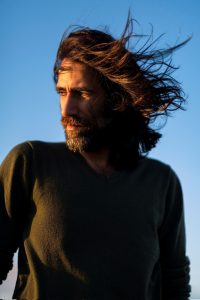 A portrait of Behrouz Boochani.